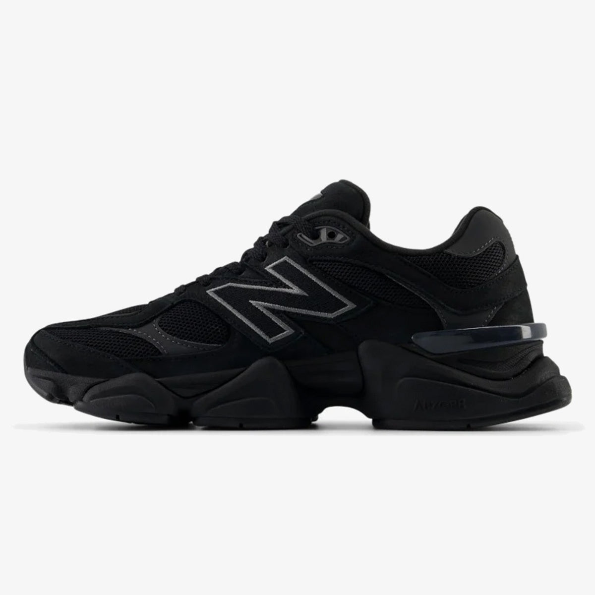 All-black NB 9060 sneaker with tonal overlays and sculpted chunky sole
